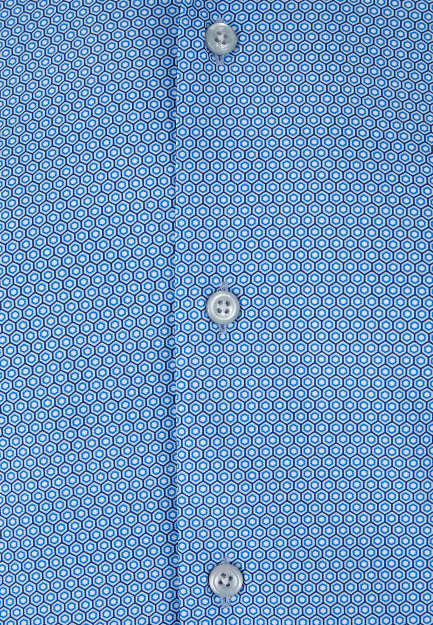 Close-up of a blue patterned shirt with buttons