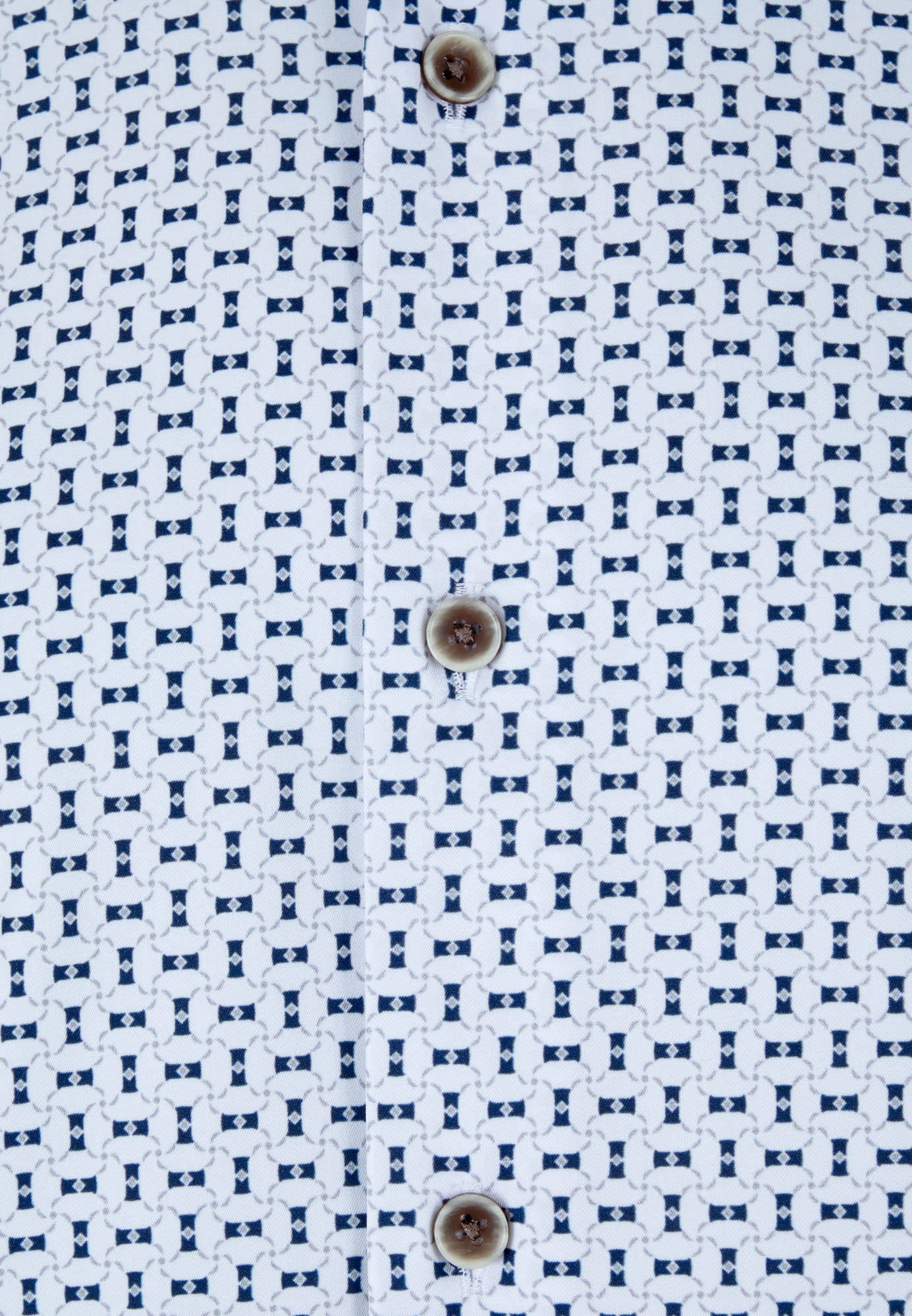 Close-up of a shirt with a blue geometric pattern on a white background