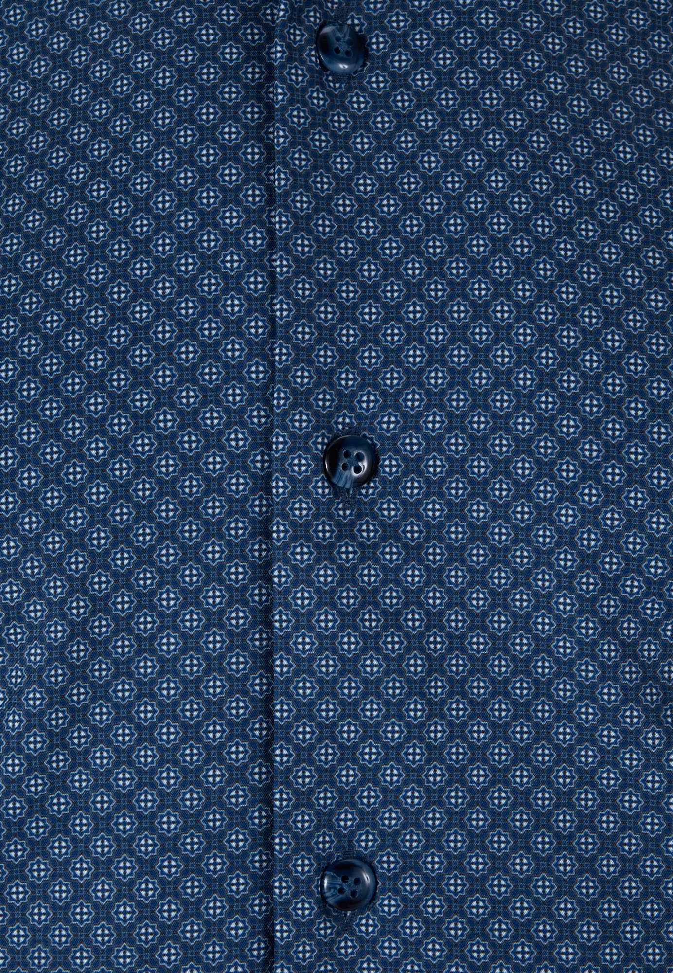 Close-up of a blue patterned shirt with buttons