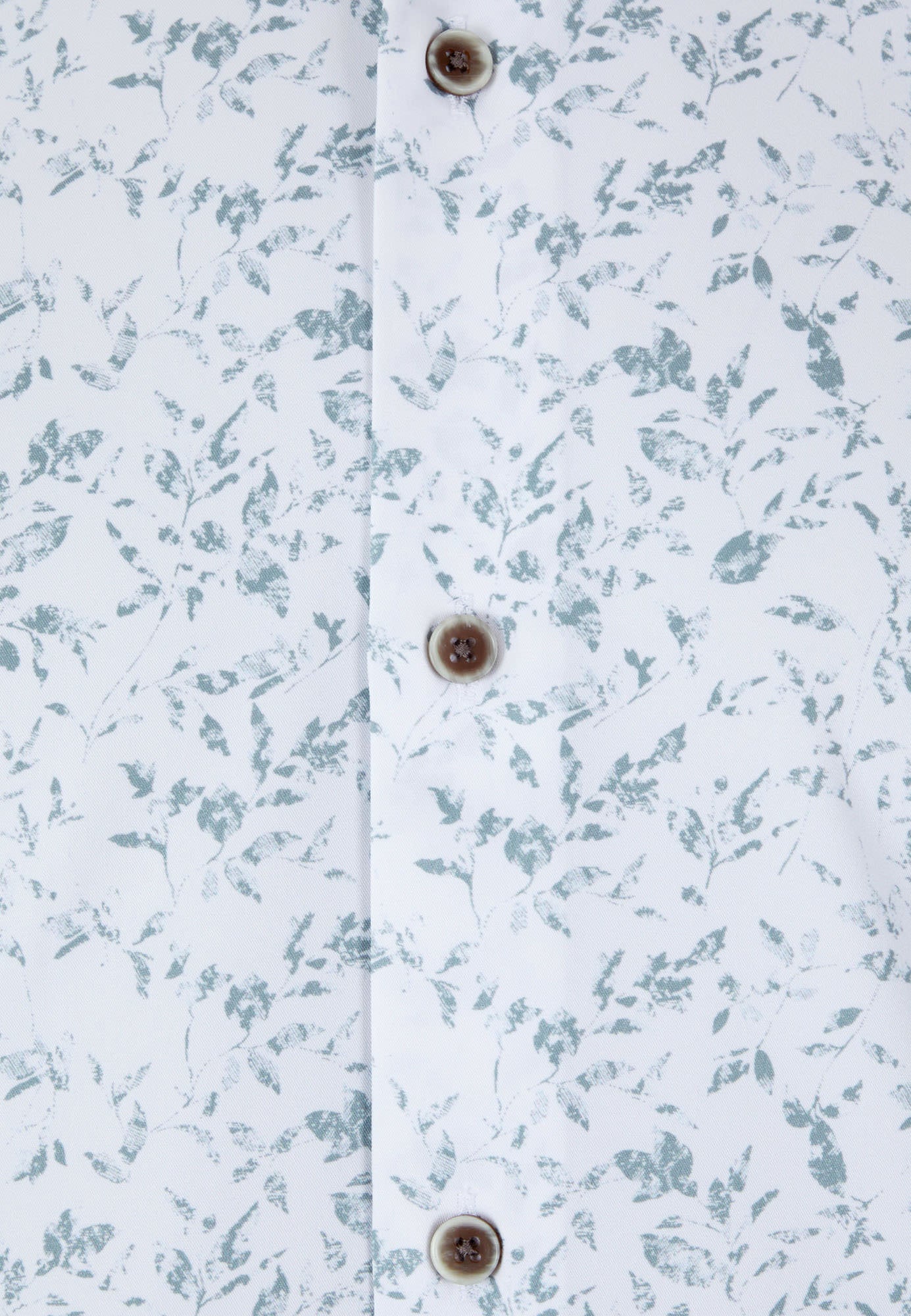 Floral patterned fabric with button details on a white background
