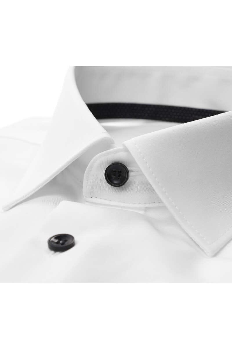 Collar detail on white tuxedo shirt with black buttons