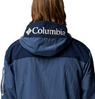 Navy blue Columbia jacket with logo on the hood against a white background