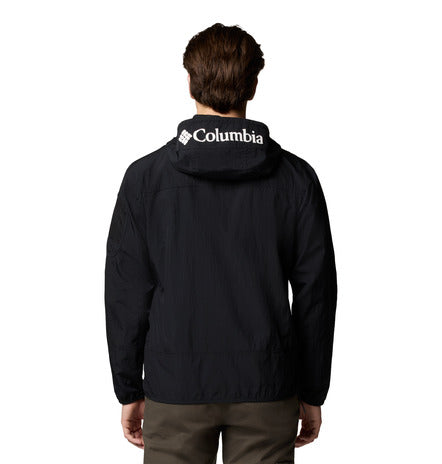 Person wearing a black Columbia jacket on a white background