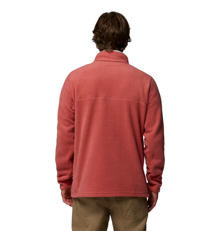 Person wearing a red fleece jacket on a white background