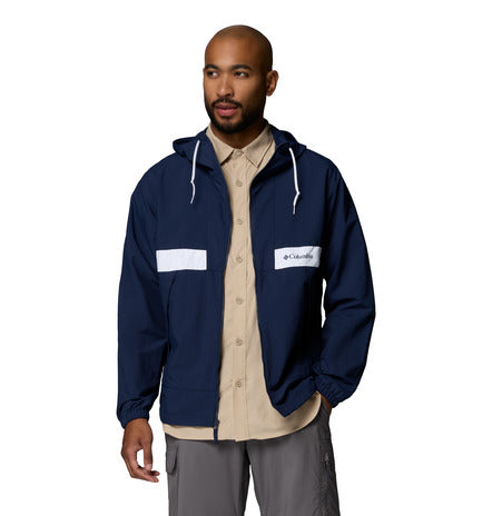 Man wearing a navy blue jacket with Columbia logo on a white background