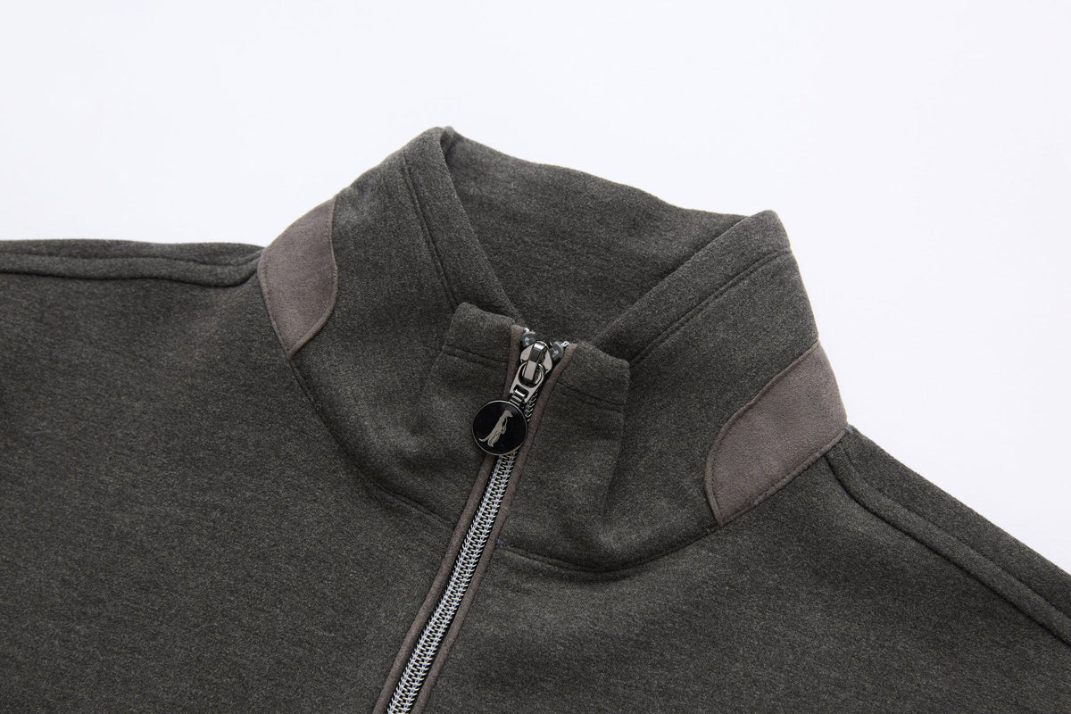 Close-up of the 6th Sense peat sweat's funnel collar with contrast shoulder panels and round logo zip pull.