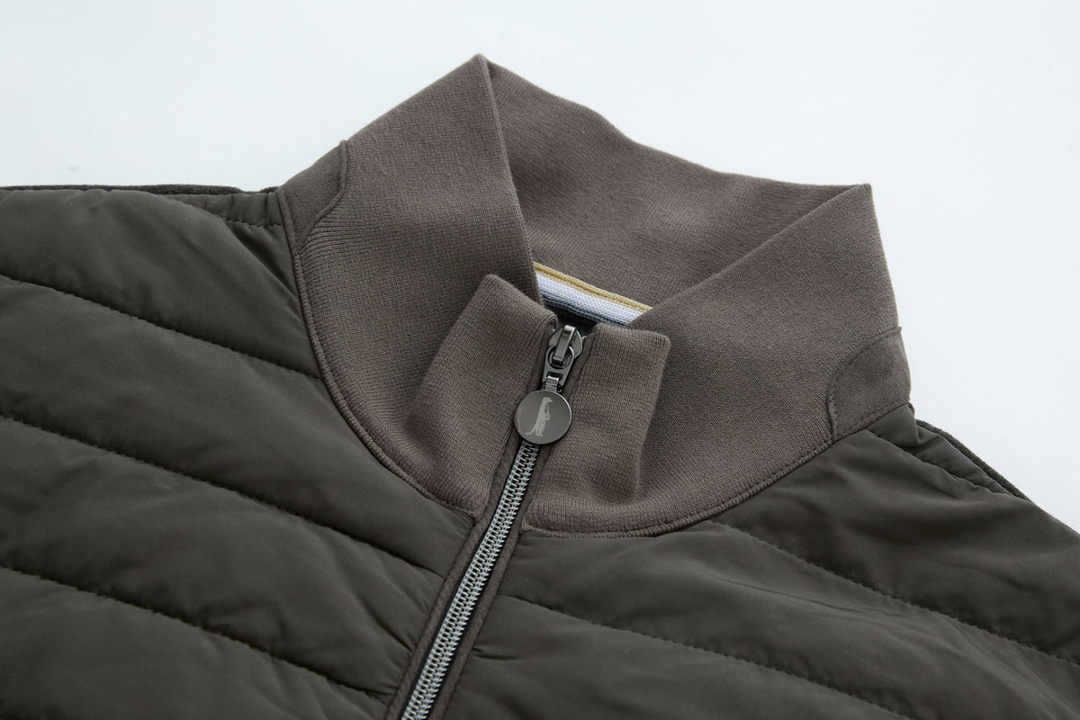 6th Sense Air Peat Gilet collar detail showing ribbed peat knit, open zip and inner neck tape.