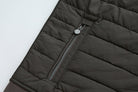 Side zip pocket on the 6th Sense Air Peat Gilet with round pull tab and horizontal quilt stitching.