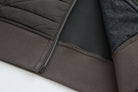 Inside hem of the 6th Sense Air Peat Gilet showing dark lining, overlock stitching and ribbed peat band.