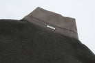Rear collar of the 6th Sense Air Peat Gilet with ribbed peat knit and small 6th Sense label.