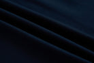 Close-up fabric detail of the 6th Sense Astound Eclipse Polo in Eclipse, showing diagonal folds and a smooth knit texture.