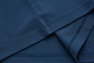 Interior seam and stitching detail of the 6th Sense Astound Ensign Polo in blue.
