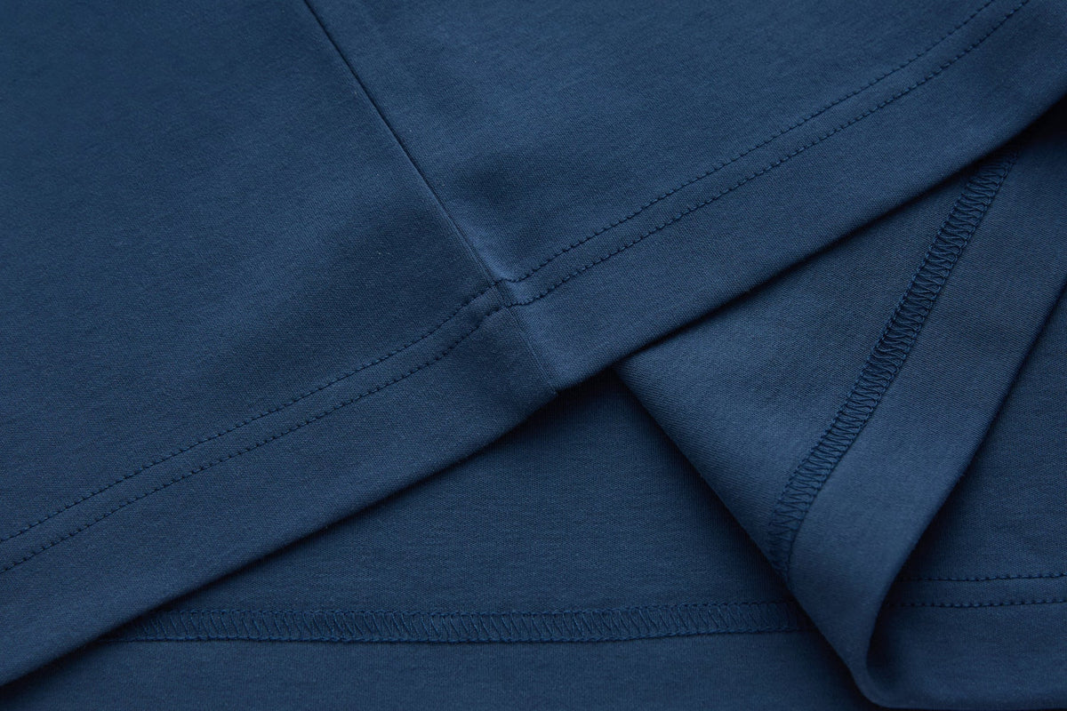 Interior seam and stitching detail of the 6th Sense Astound Ensign Polo in blue.