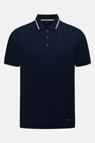 6th Sense Astound Eclipse Polo in Eclipse, front view. Short-sleeve polo with a three-button placket, striped collar trim, striped sleeve cuffs, and a small woven label above the hem.