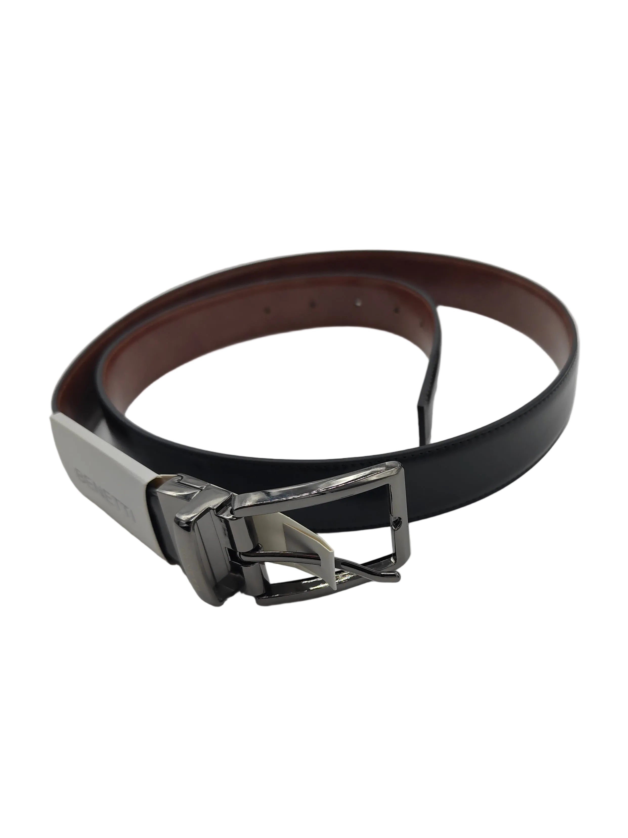 Black or tan reversible belt with silver buckle on a white background