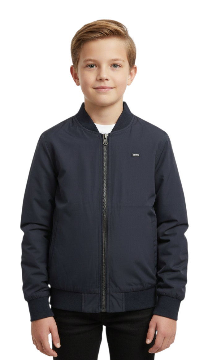Young boy wearing a navy blue jacket on a white background