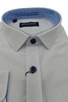 Folded boys white formal shirt with navy detail