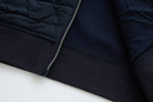 6th Sense Cloud Hybrid Full Zip Navy Jacket lower front hem showing silver zip, quilted panel and ribbed hem