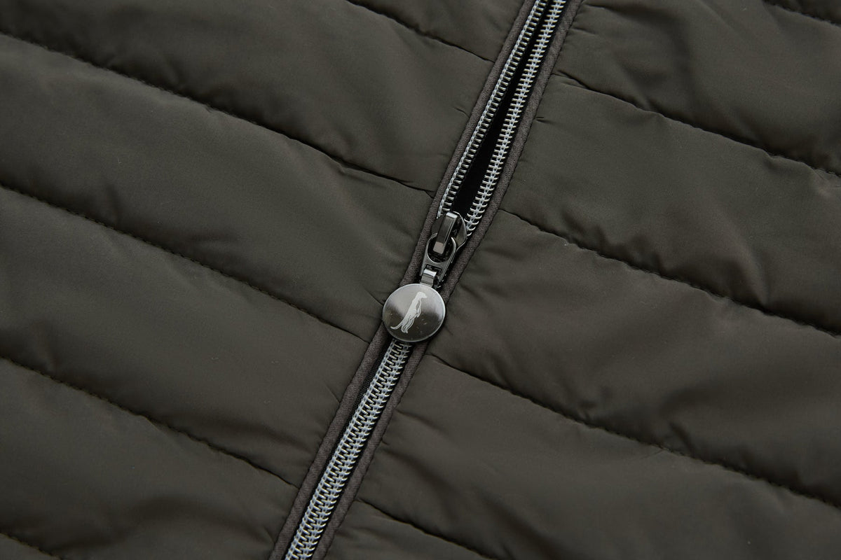 6th Sense Cloud Hybrid Full Zip Peat Jacket zipper detail featuring a circular pull tab with a logo on the quilted peat fabric.