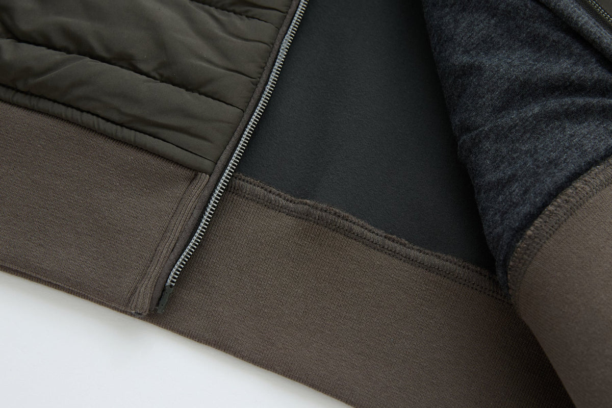 6th Sense Cloud Hybrid Full Zip Peat Jacket inside view showing the hem, zipper tape, and interior lining.