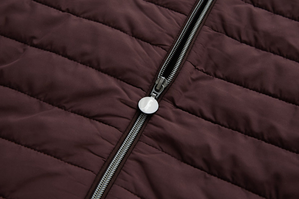 Silver zip and round pull on the quilted front of the 6th Sense Cloud Hybrid Full Zip Plum Jacket