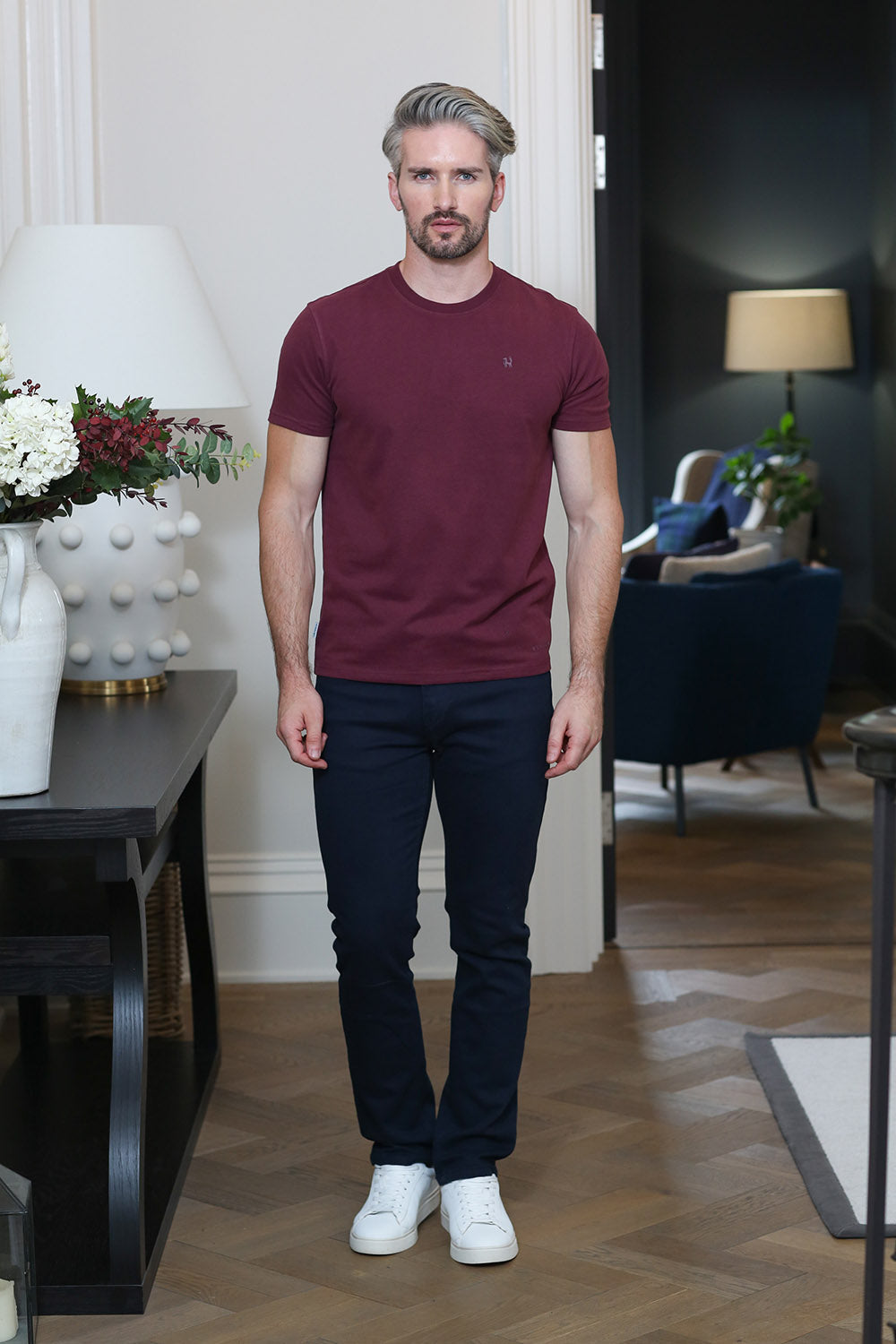 Kenrow Connor Tee in maroon worn by model with dark trousers and white trainers
