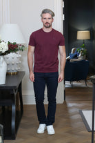 Kenrow Connor Tee in maroon worn by model with dark trousers and white trainers