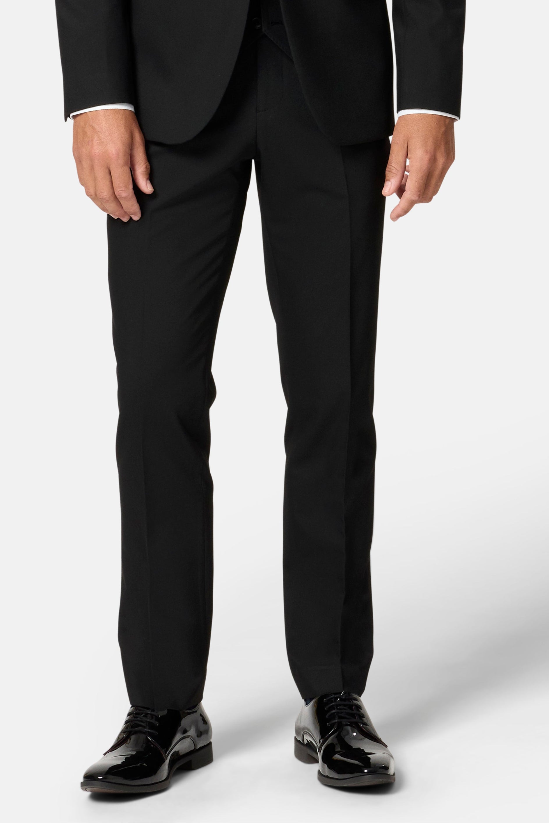 Man wearing a black trousers with a white shirt  on a white background