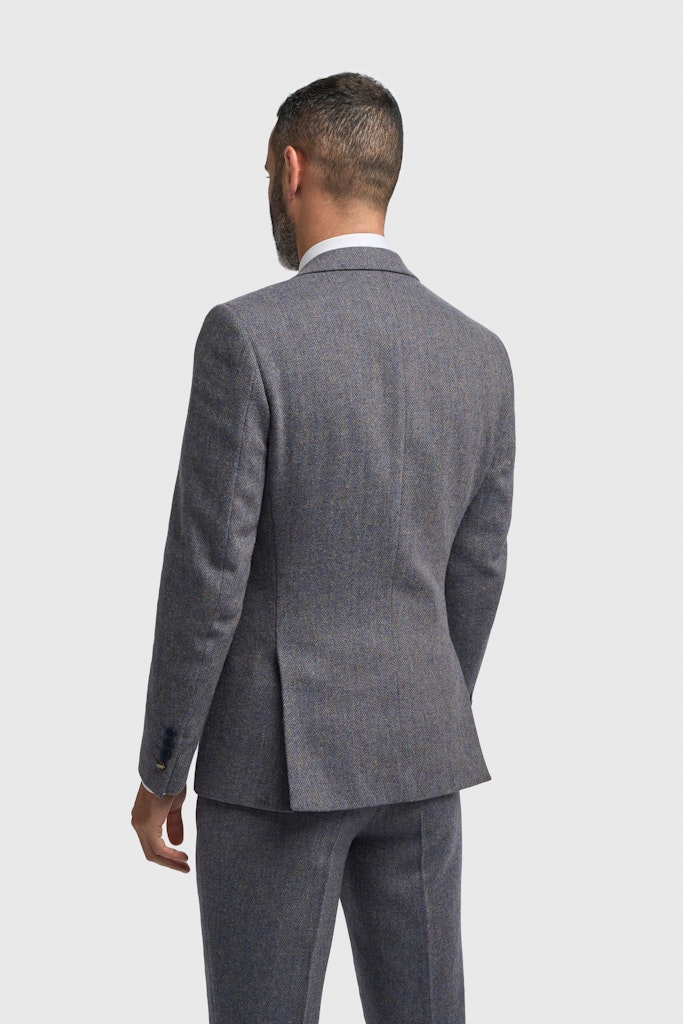 Man wearing a gray suit on a white background