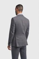 Man wearing a gray suit on a white background