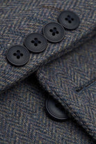 Close-up of a textured fabric with black buttons