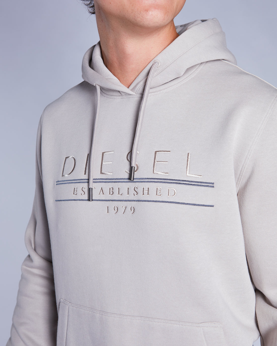 beige  hoodie with Diesel logo on a plain background