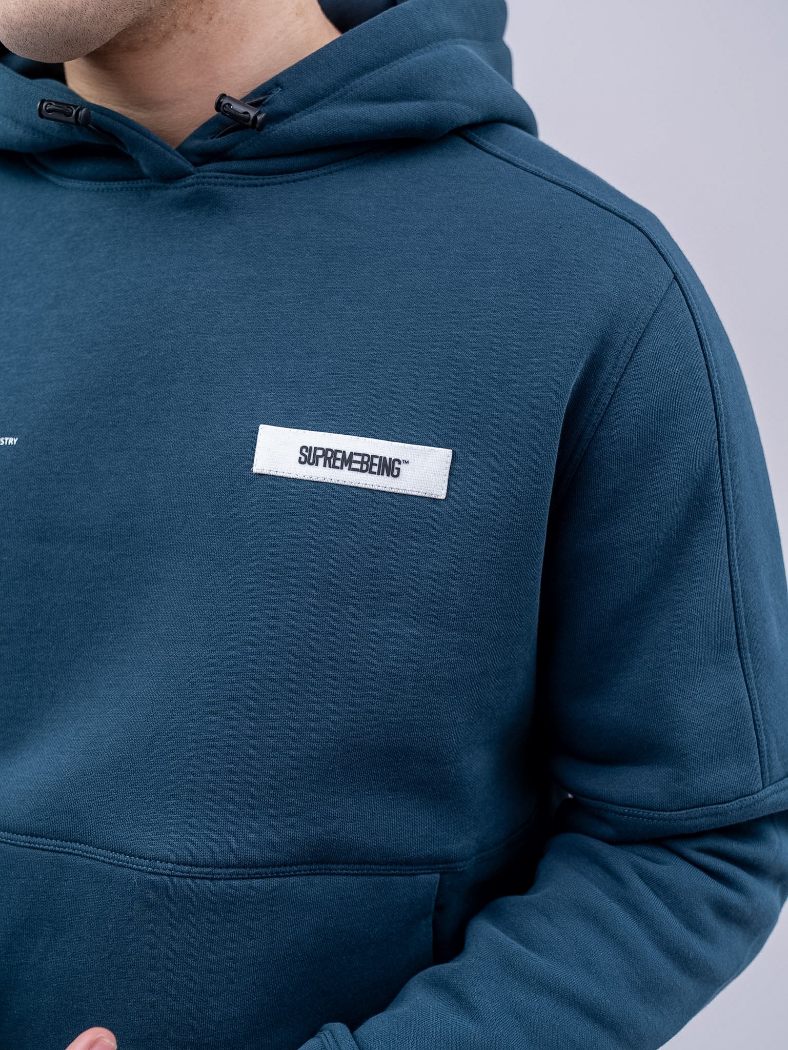 Supreme Being Diego Hood Navy Azure, logo view