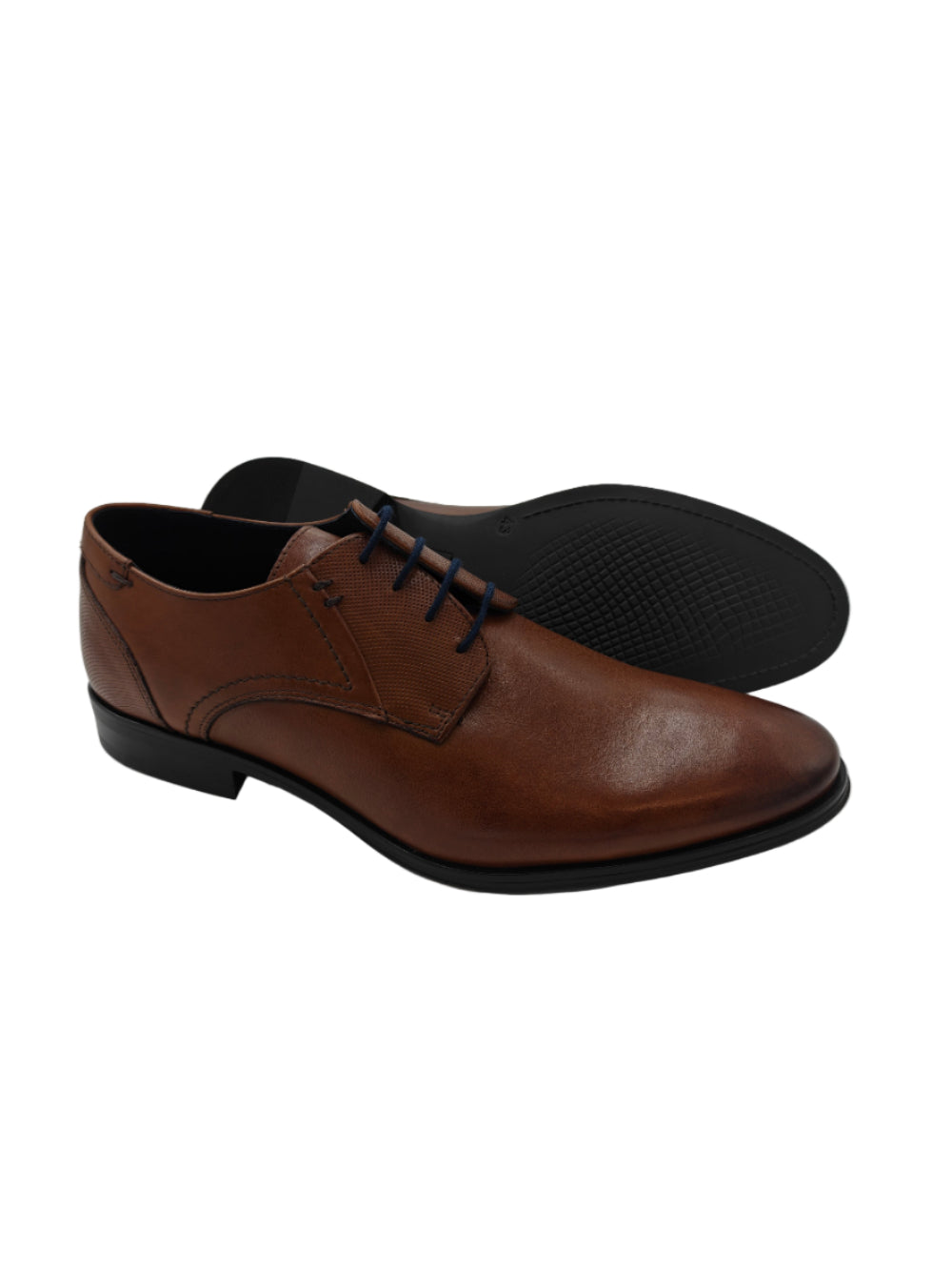 Brown leather dress shoes on a white surface 