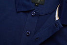 Close-up of 6th Sense Evoke dress blue polo placket with two buttons and size M label