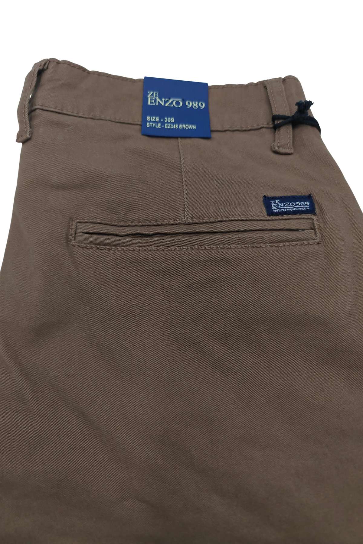 Brown pants with Enzo 989 labels on a white background
