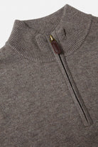 Close-up of the Benetti Franco Brown 1/4 Zip knit, showing the ribbed collar and quarter-zip closure with leather pull tab.