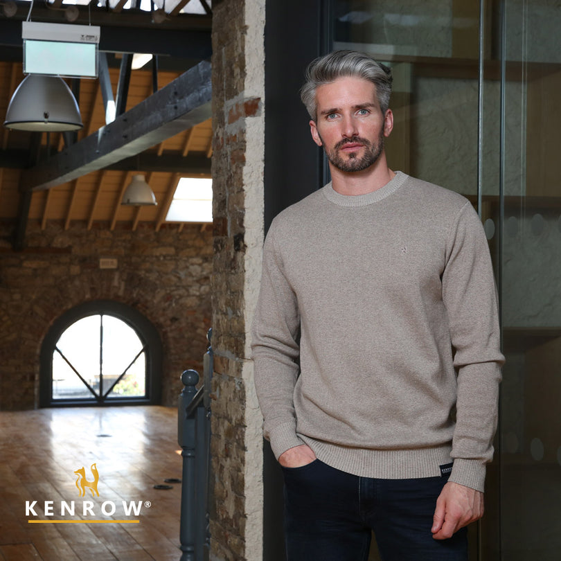Man wearing a sand colour crew neck jumper