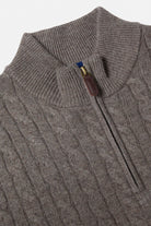 Close-up of a Benetti Grant Brown 1/4 Zip knit with cable texture, ribbed collar, and zip pull detail.