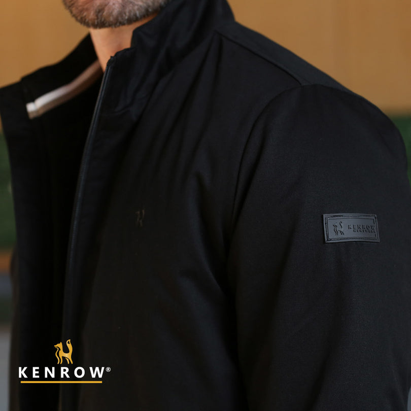 Man wearing a black harrington/bomber style jacket showing Kenrow logo tab on the sleeve