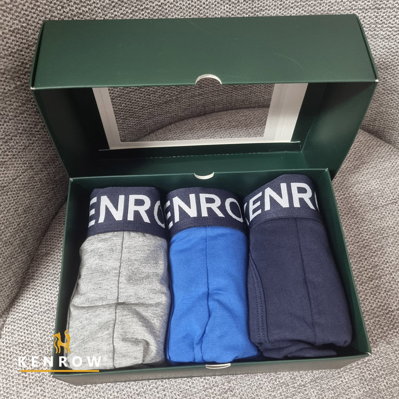 Three pairs of men's underwear in gray, blue, and navy in a green box with 'KENROW' branding.