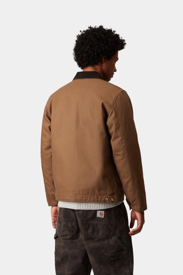 Man wearing a brown jacket on a white background