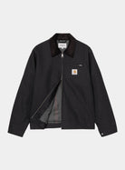Carhartt WIP Detroit Jacket in Dark Navy / Black, front view with zip closure, corduroy collar, chest pocket, and blanket lining visible.
