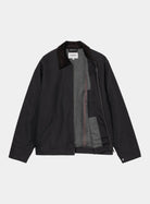 Carhartt WIP Detroit Jacket in Dark Navy / Black, front view with corduroy collar, zip front, and grey blanket lining visible