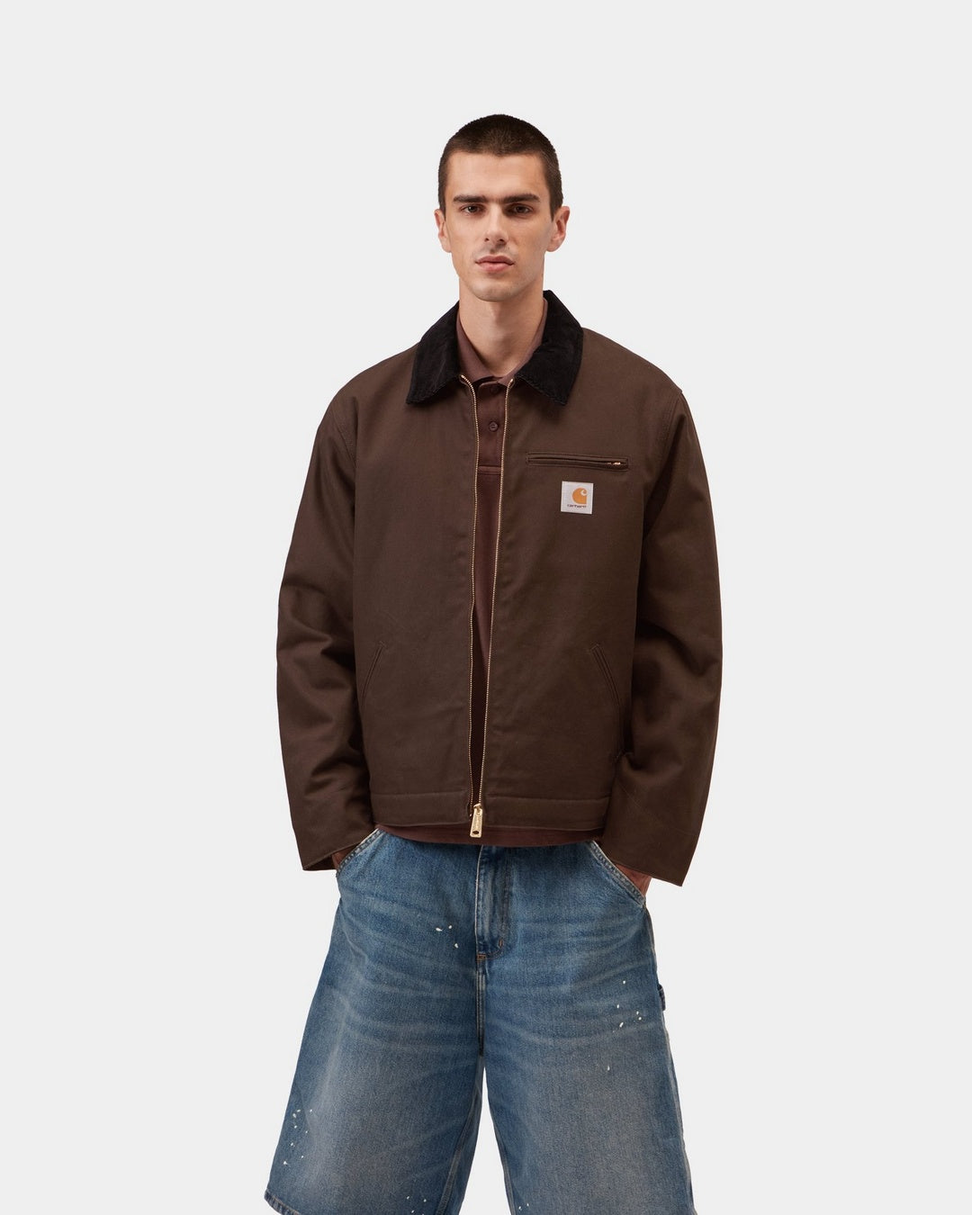Carhartt WIP Detroit Jacket in Tobacco / Black, front view with black corduroy collar, gold-tone zip and chest pocket logo patch, shown on model.