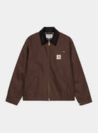 Carhartt WIP Detroit Jacket in Tobacco / Black, front view with black corduroy collar, gold-tone zip, chest pocket, and logo patch.