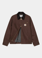 Carhartt WIP Detroit Jacket in Tobacco / Black, front view with black corduroy collar, gold-tone zip, chest pocket zip, and grey lining visible