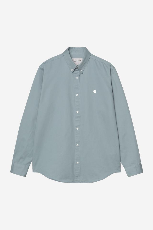 Light blue button-up shirt with a small logo on a white background