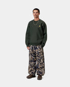Carhartt WIP American Script Sweatshirt in Raven, shown worn on a model with small chest logo embroidery.