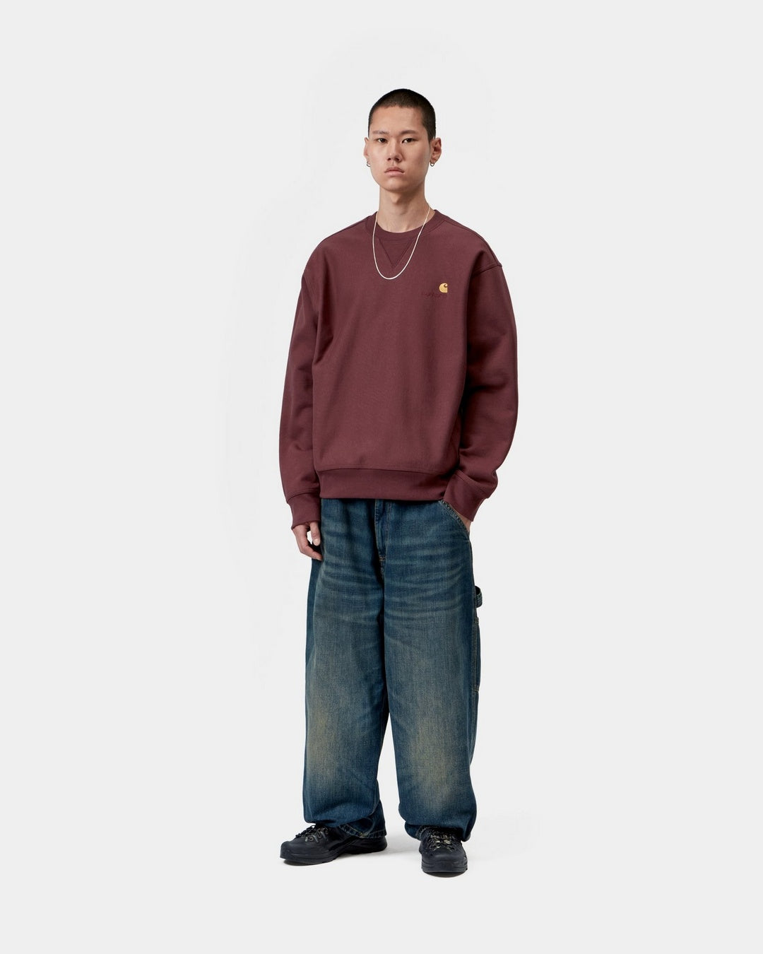 Carhartt WIP American Script Sweatshirt in Amarone, shown on model in a front view with chest logo embroidery.